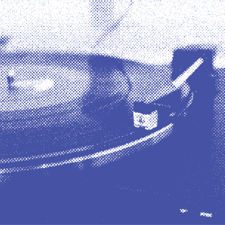 Close-up of a vinyl record spinning on a turntable with the needle playing the grooves.