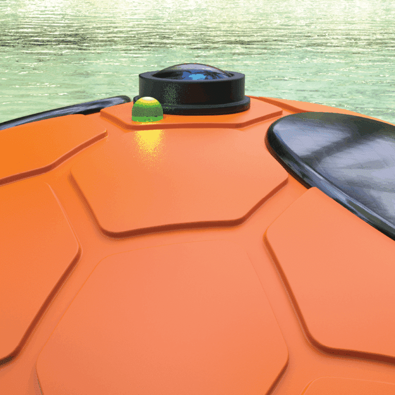 Close-up digital render of the top of the Guardian Pool Alarm, focusing on the camera lens, solar panels and flashing LED diode. The device is shown floating in the water.