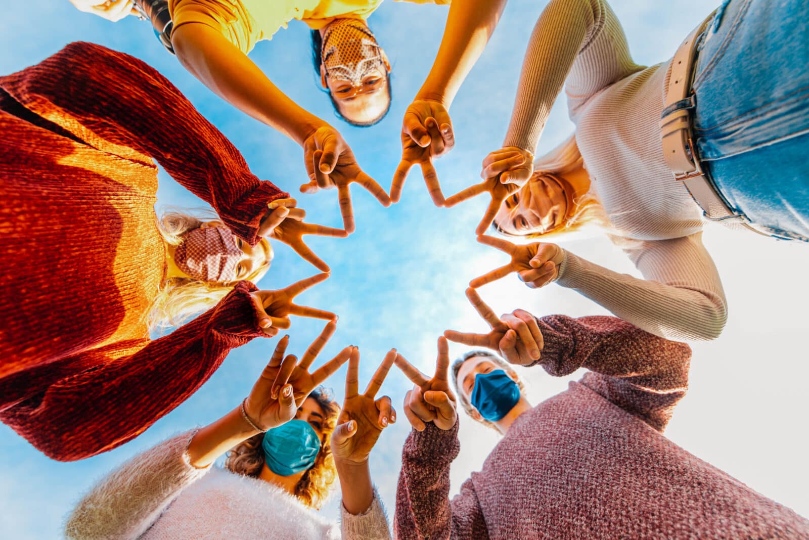 Uniting people in circle with fingers as weaving patterns.