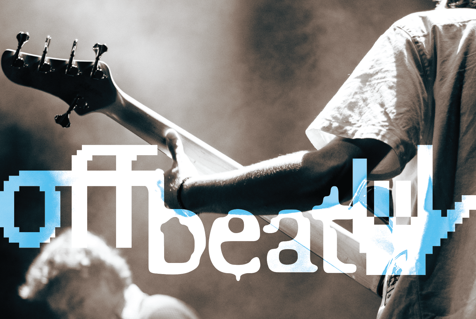 Photo of guitarist with offbeat logo layered over the top.