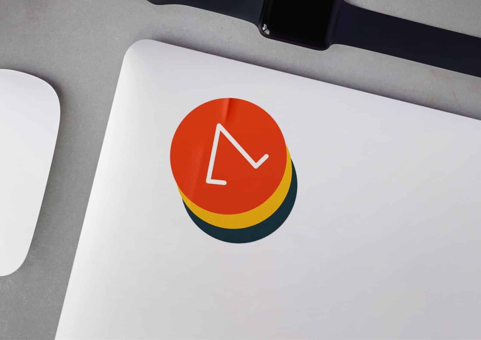 WALKKA sticker placed on the surface of a laptop.