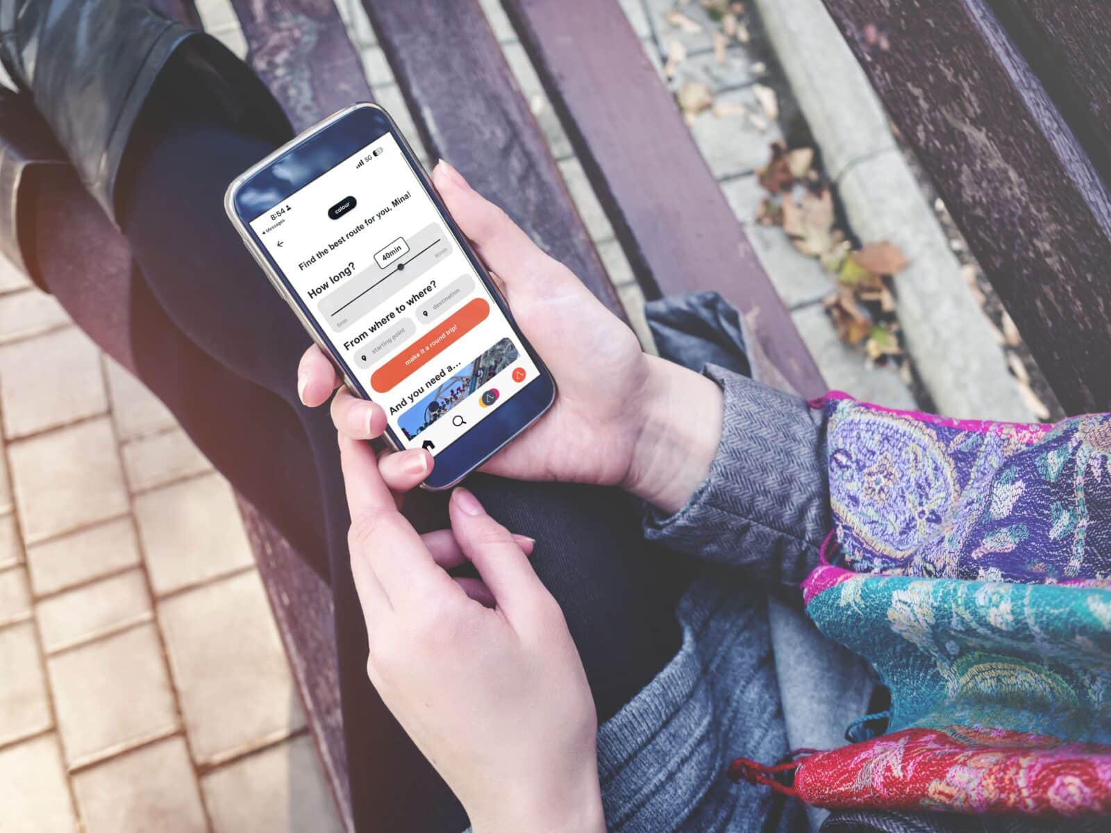 Smartphone held in a hand, screen showing the “Build My Own Route” section of the WALKKA mobile app interface.