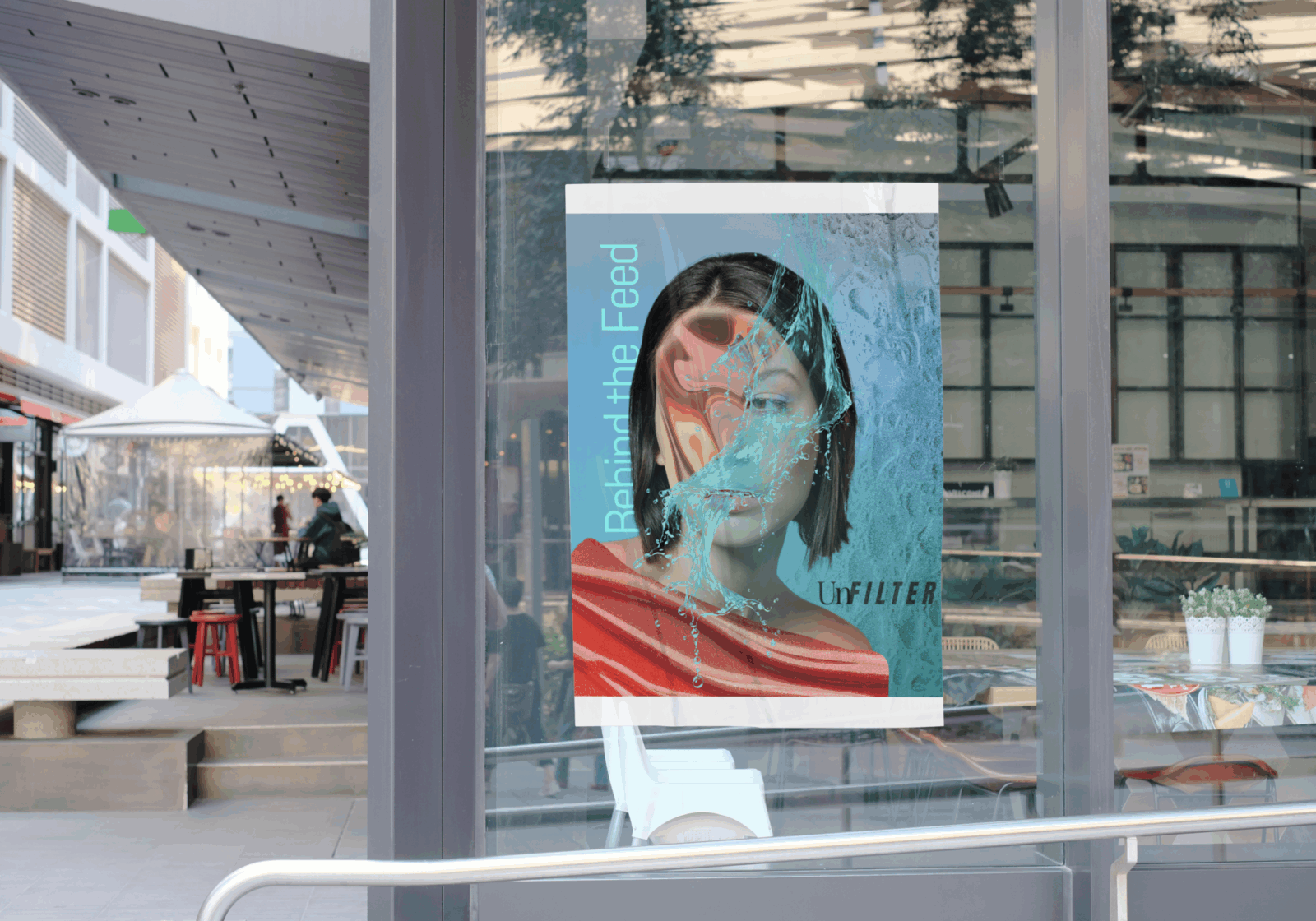 A striking poster placed on a glass window in an urban alleyway. It shows a woman with short hair obscured by splashes of water and glitch-like distortion over her face. Text on the left reads “Behind the Feed.” The layered visual suggests digital fragmentation and curated identity. The UnFILTER logo appears bottom right.